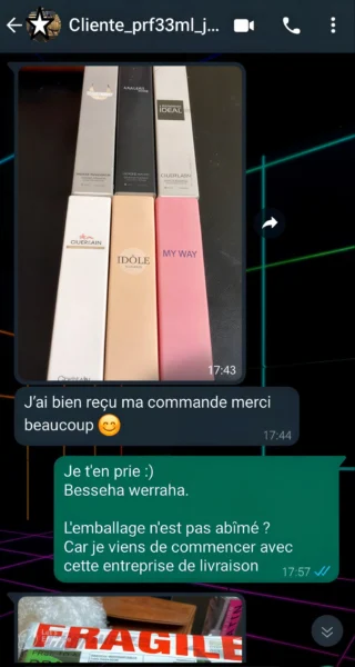 Photo WhatsApp d'un déballage de commande de plusieurs parfums 33ml reçus par une cliente à Casablanca.